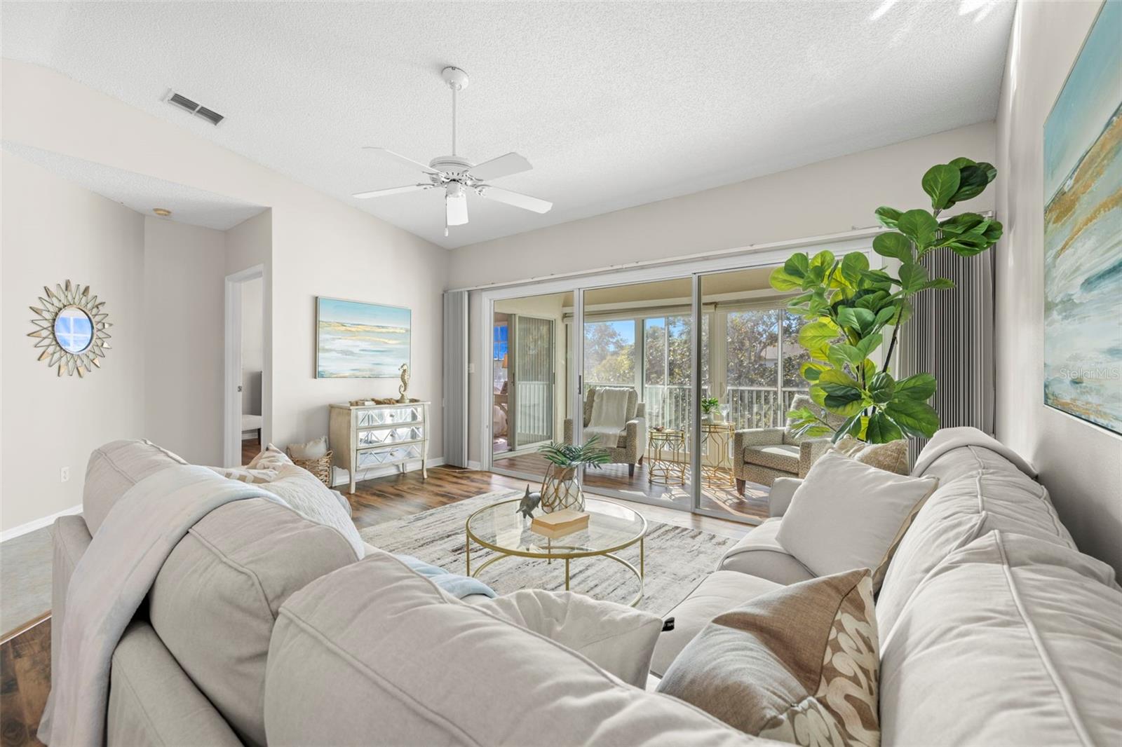 living room showing enclosed Florida room