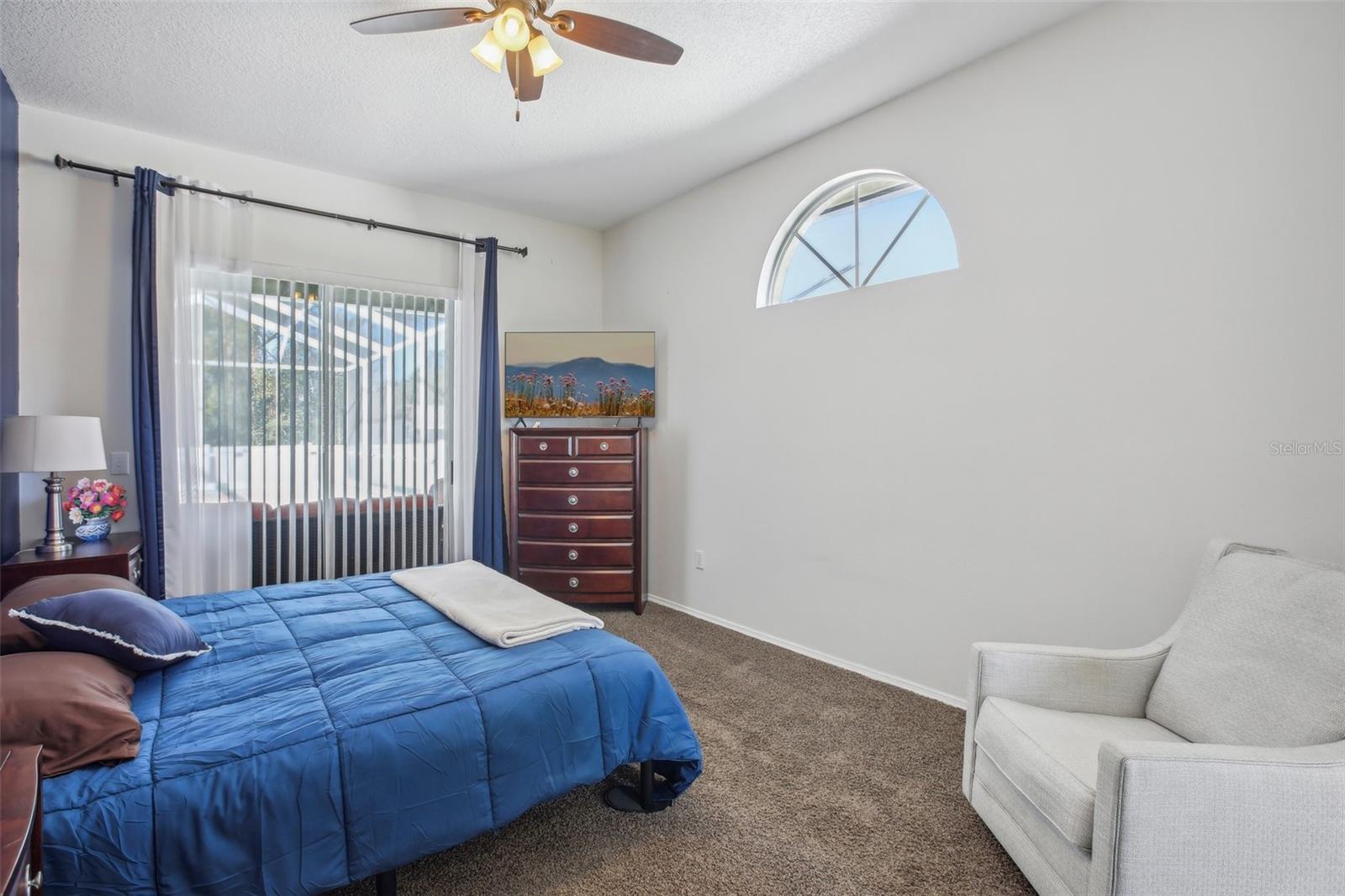 primary bedroom with sliders to the lanai