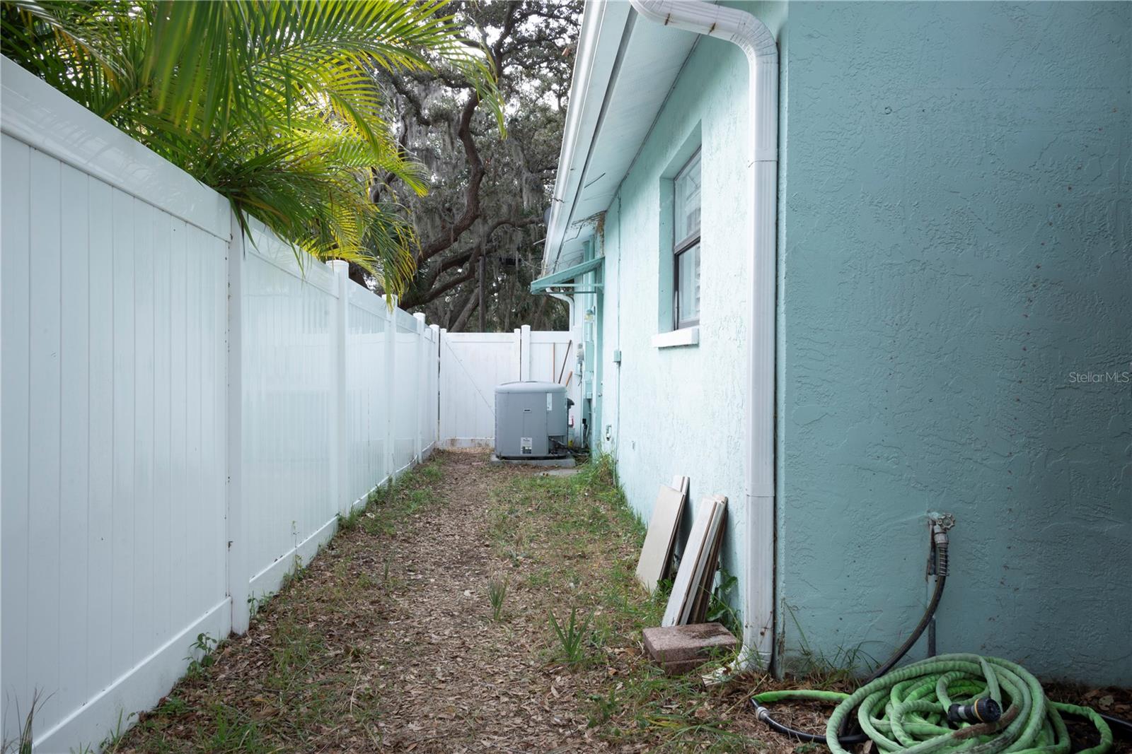 White Vinyl fencing surounds the back yard