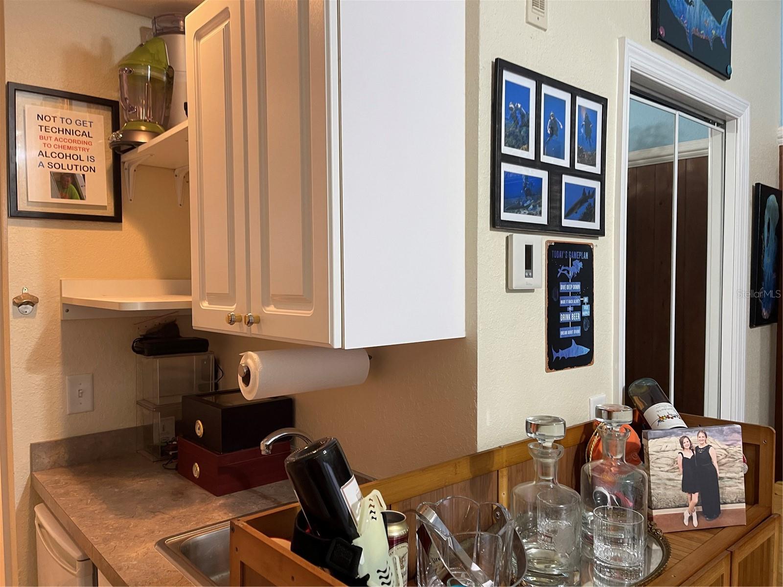 Wet bar with mini-refrigerator.