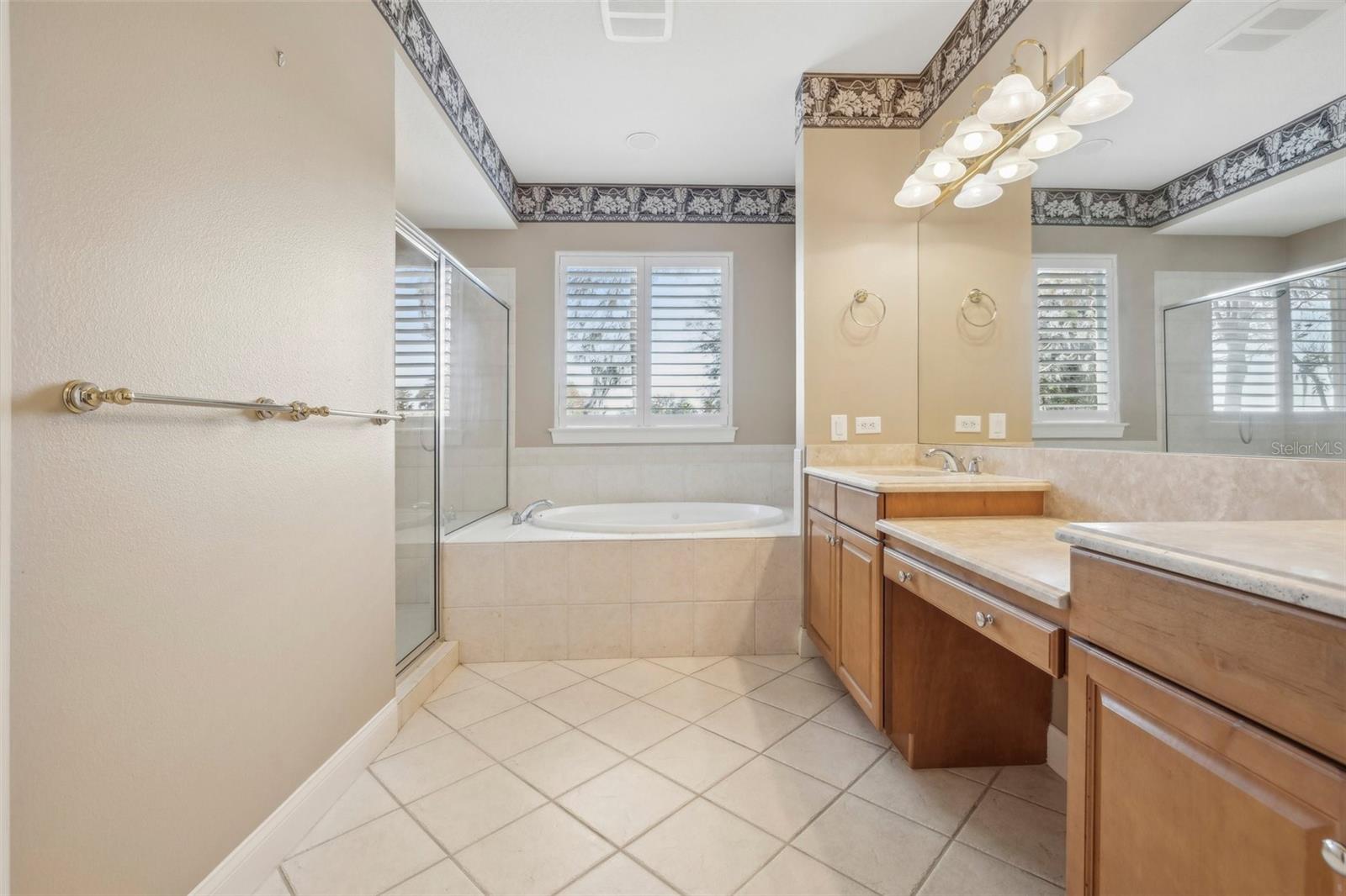 Master bath with jacuzzi tub and walk-in shower