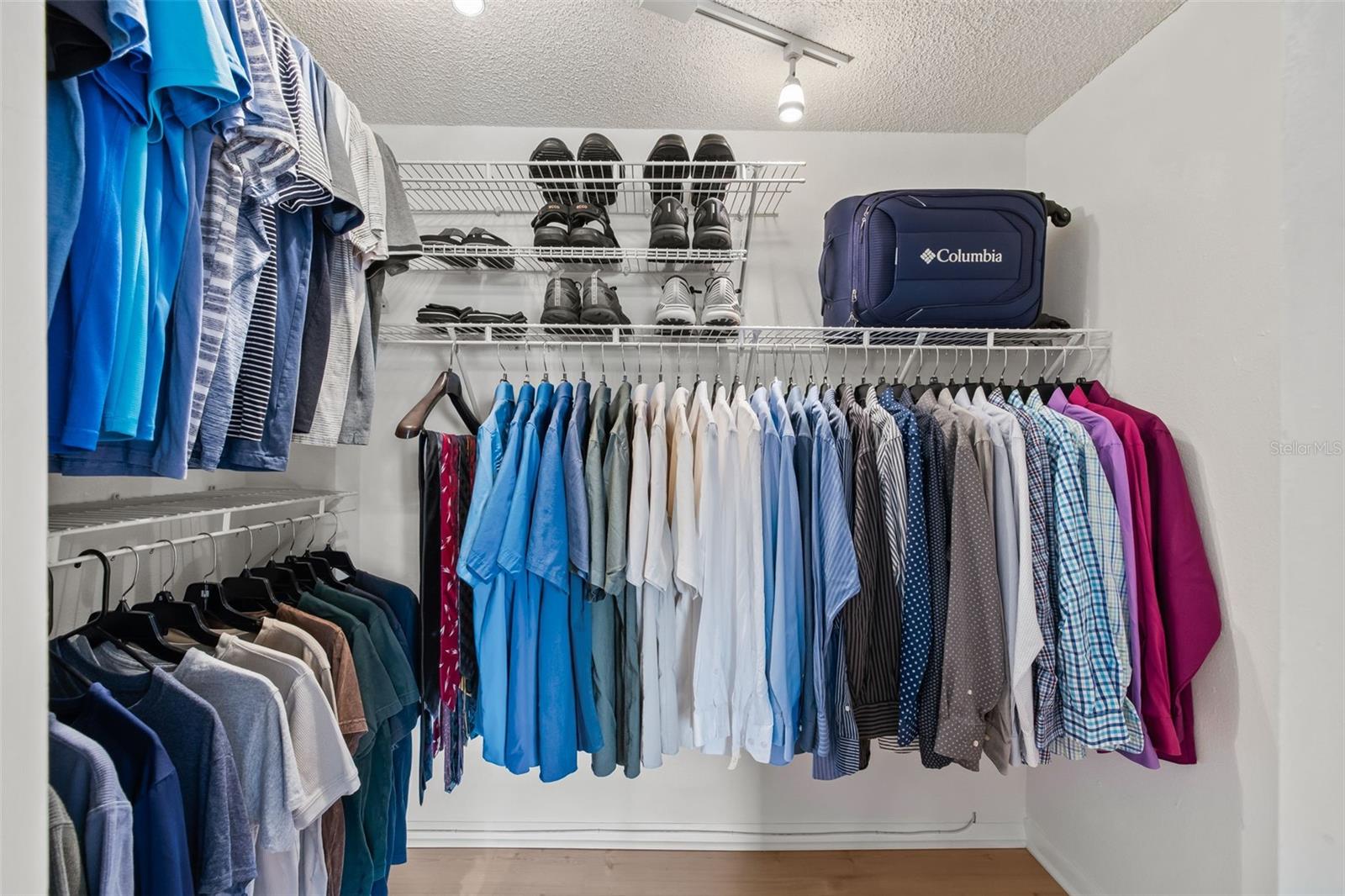 Primary bedroom walk-in closet.