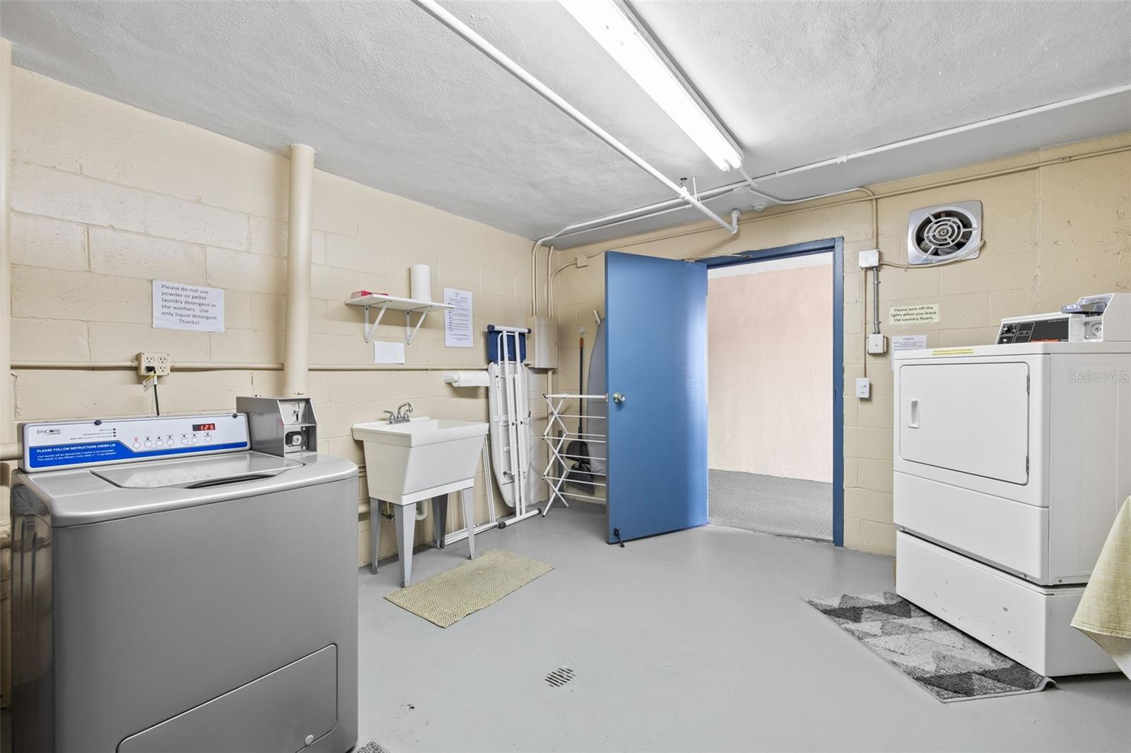 Laundry room down the hallway from unit.