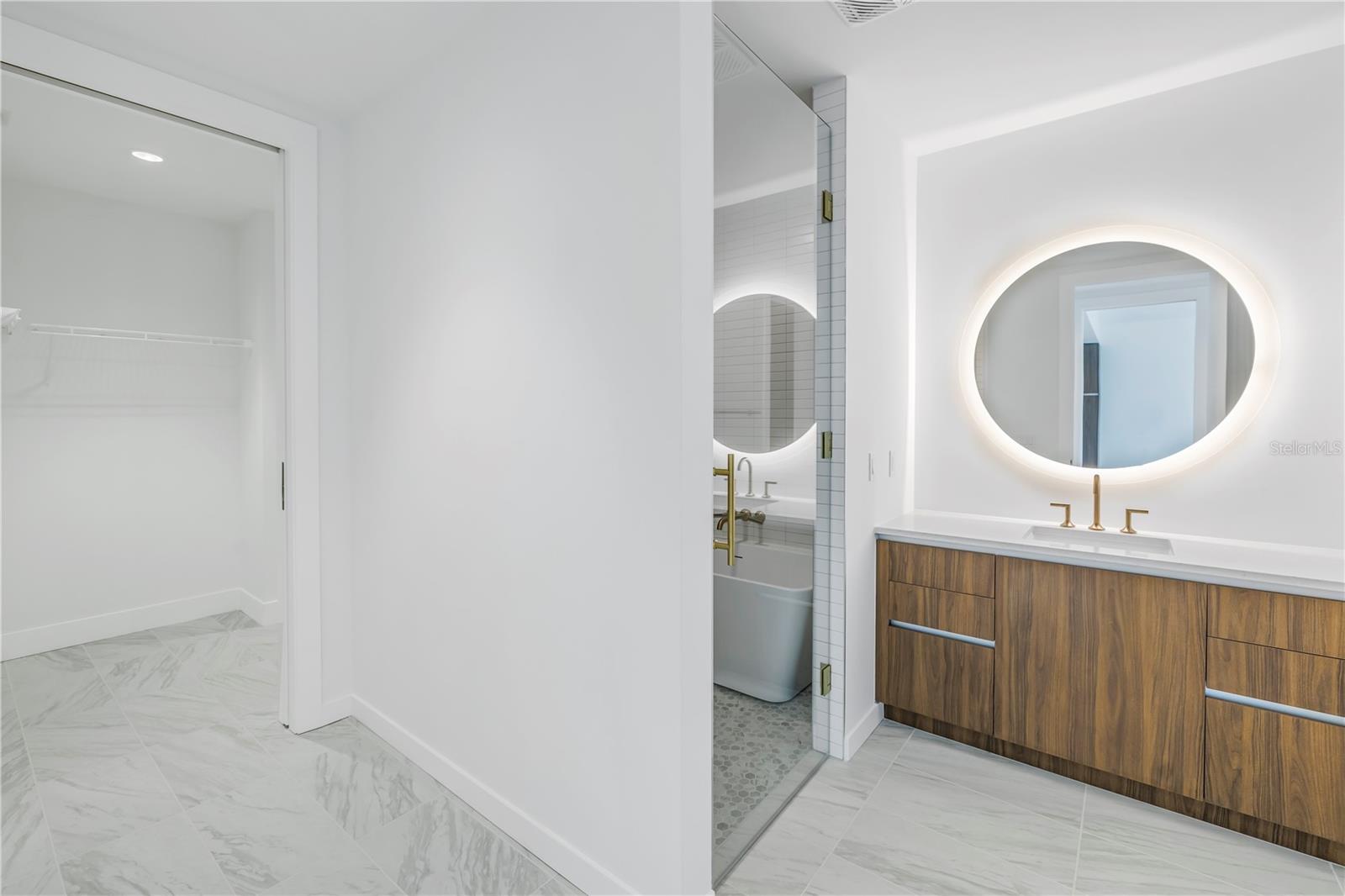 Primary bathroom with backlit mirror