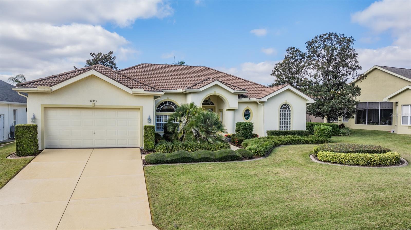 Lush lawn with painted driveway