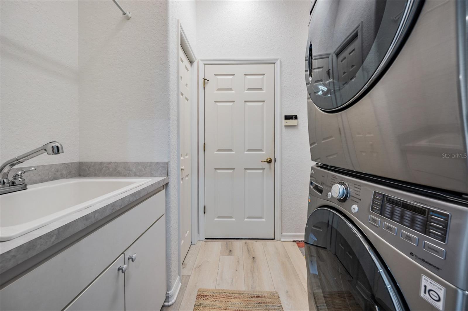 interior laundry room with utility sink