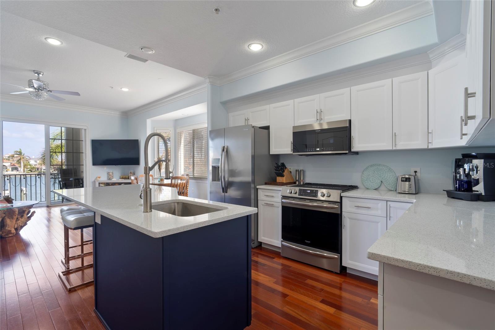 Kitchen remodel 2023 including beautiful new quartz countertop. Kitchen includes pantry and elevator entrance.