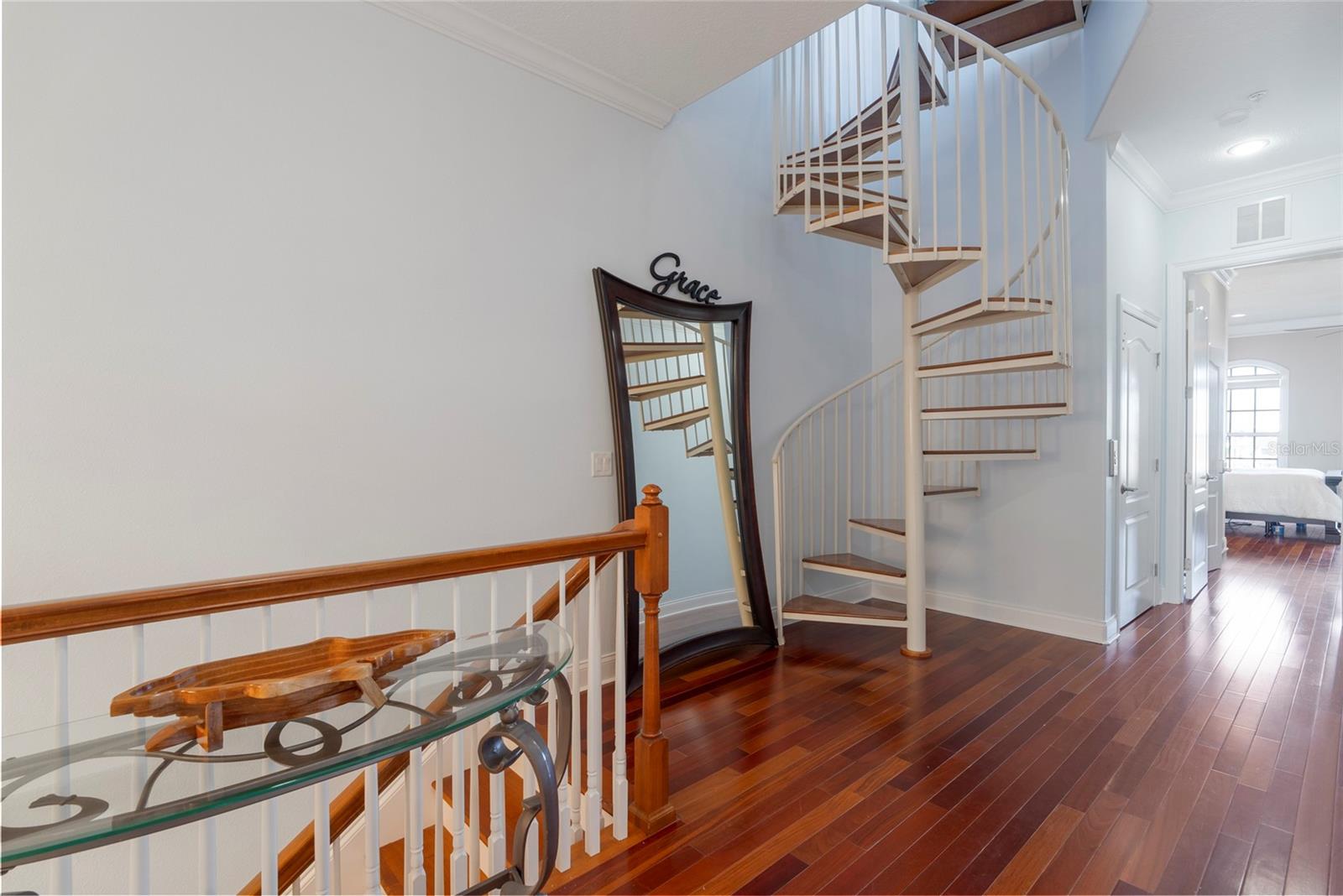 Third level - you can use the Spiral Stairway to get to your rooftop terrace or the elevator!  The third level has the Master on the north side, a laundry room and the 3rd bedroom with adjoining bath on the south side.