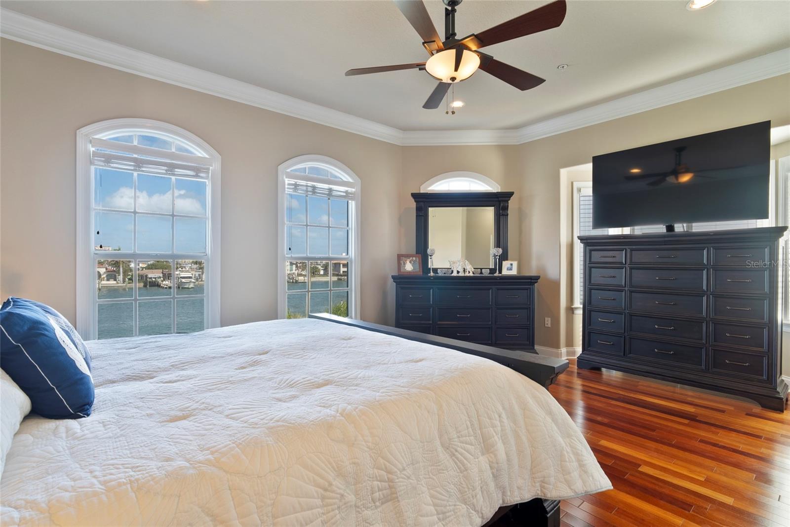 Master Retreat - large elegant windows offer postcard perfect views!  The current owners have a large dresser in the area that could also serve as a seating area.