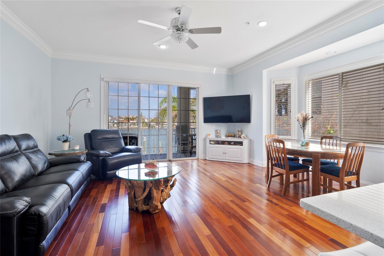 Spacious light and bright living area with 10' ceilings and beautiful water views. Brazilian cherry wood floors grace the kitchen, hallways and living/family areas.