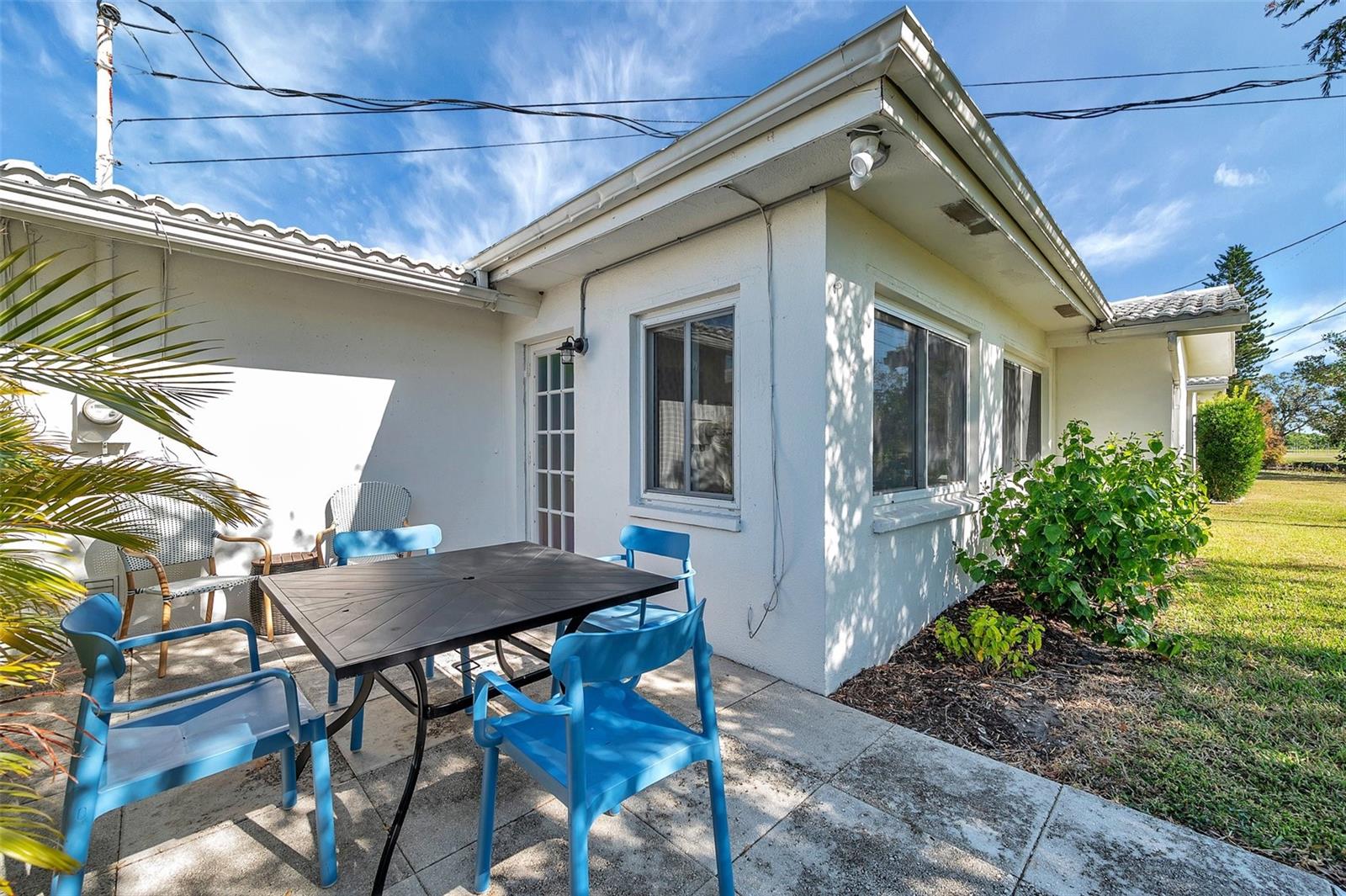 Back of house with patio