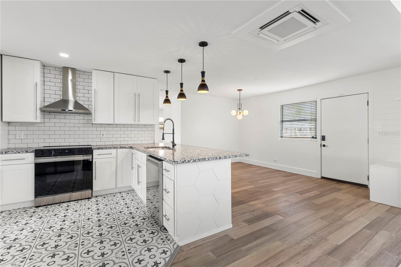 Experience culinary delight in this South Tampa home featuring a new Samsung WiFi-controlled premium range, dishwasher, and refrigerator.