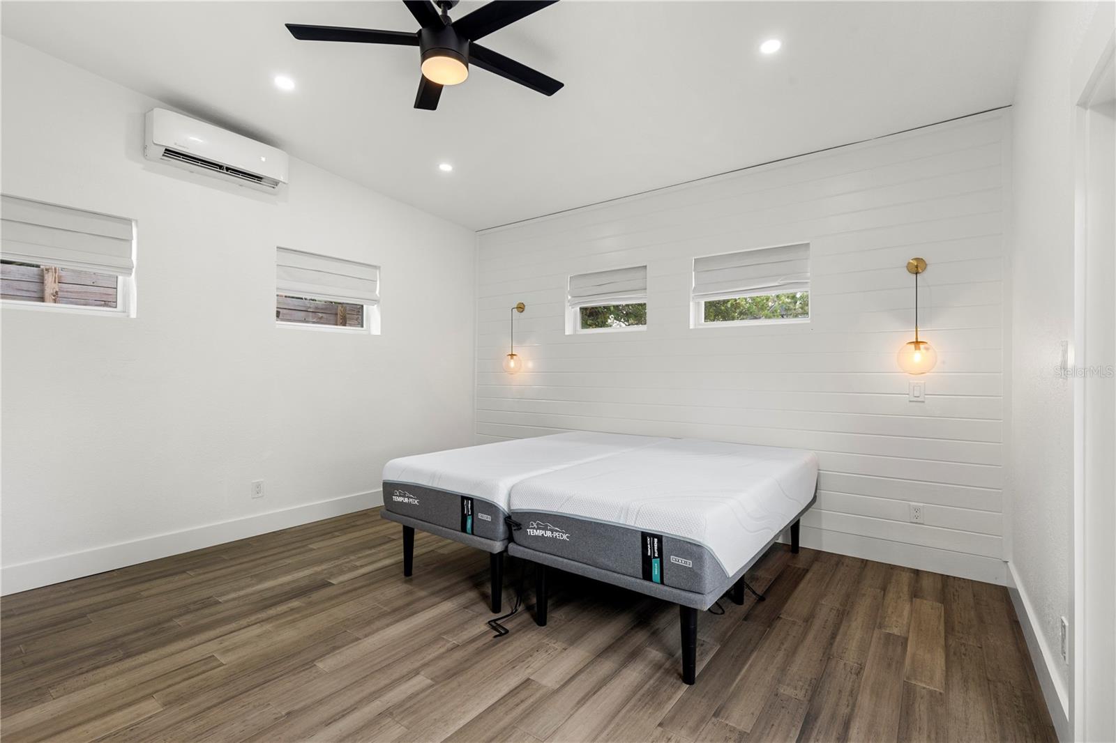 Retreat to the stunning master bedroom with soaring 12-15’ ceilings, elegant design, and ample natural light—perfect for creating your own tranquil sanctuary.