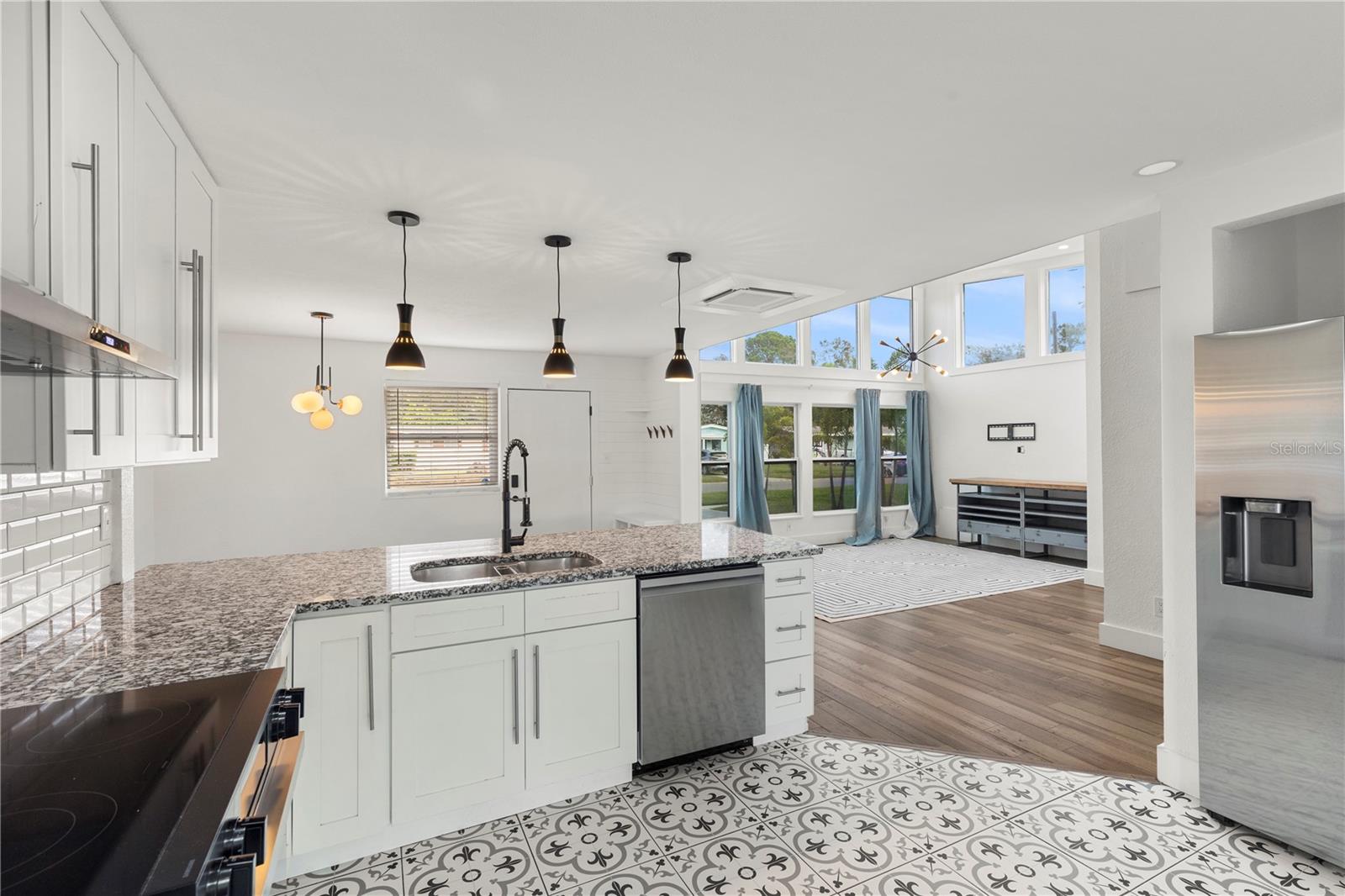 Experience culinary delight in this South Tampa home featuring a new Samsung WiFi-controlled premium range, dishwasher, and refrigerator.