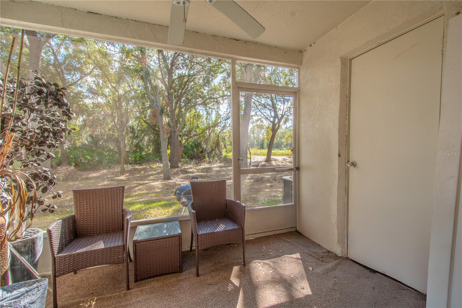 The private screened in porch has additional storage.