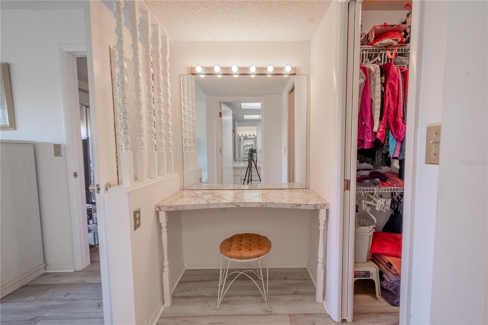 The primary bedroom has a builtin vanity with lighted mirror.