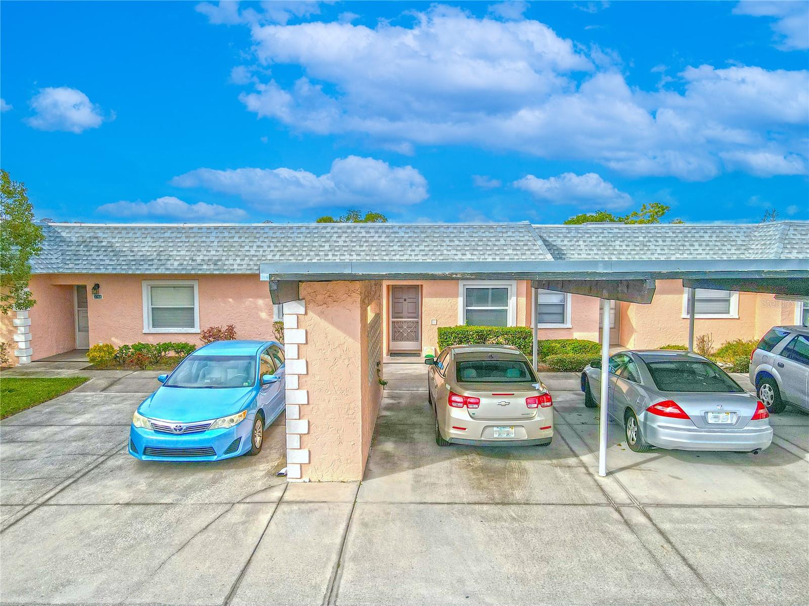 Covered carport parking in front of unit.