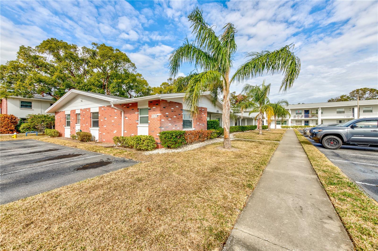 PALM TREES AND SIDEWALKS TO TAKE YOUR EVENING STROLL