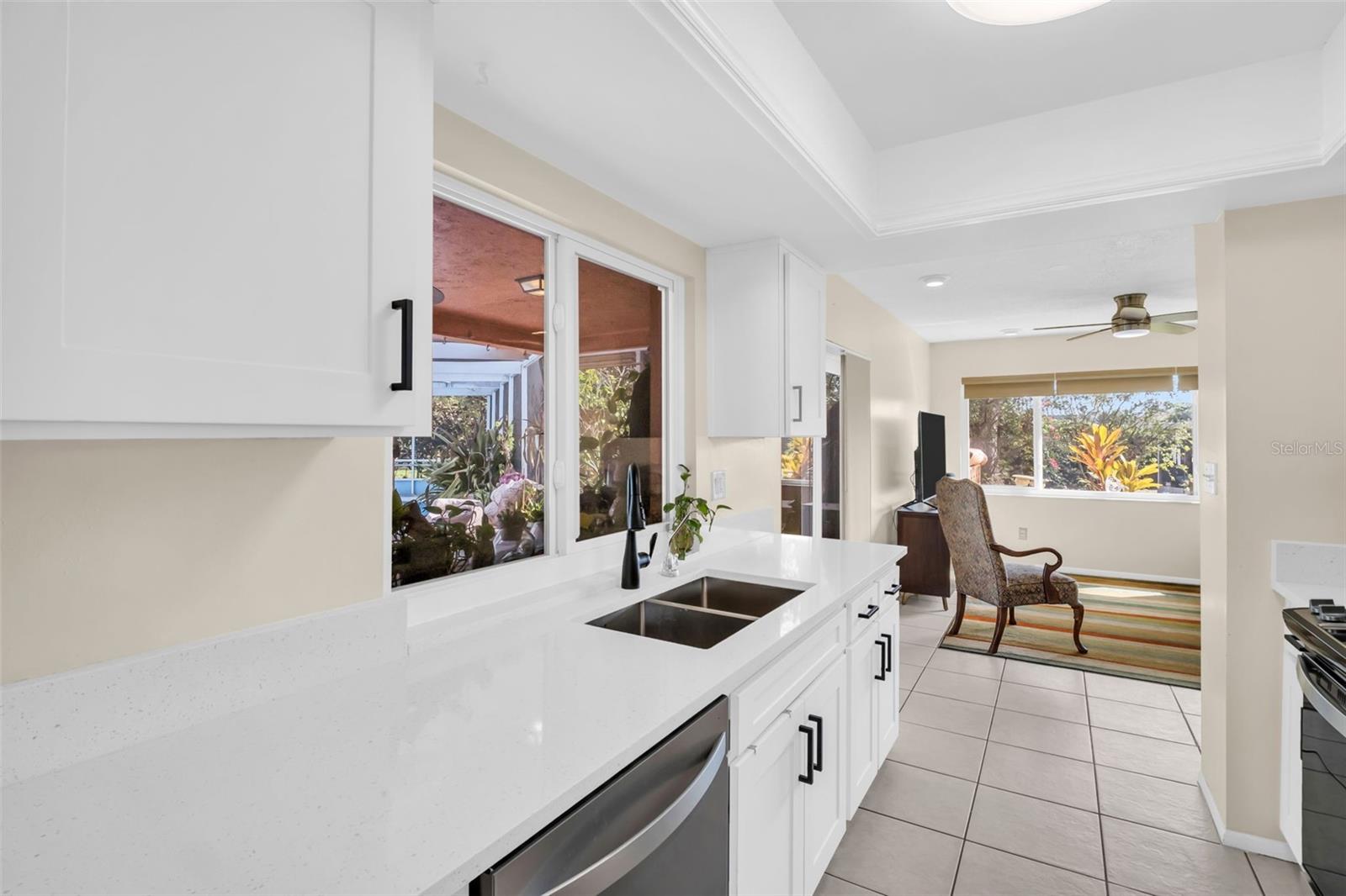 Renewed cabinets, quartzite counters, upgraded hardware, fixtures & raised tray ceiling~