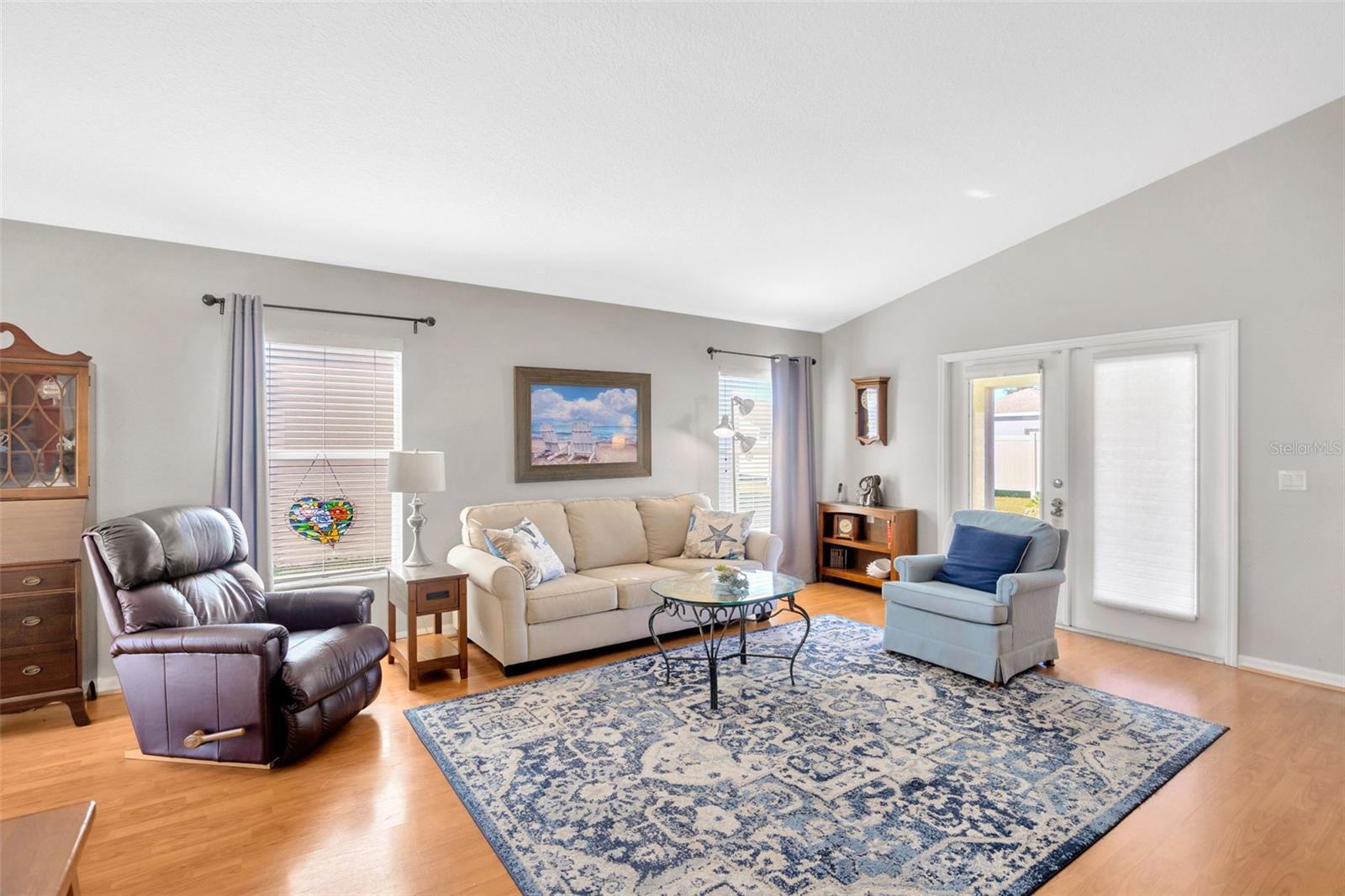 High ceilings, lots of natural light, French doors to screened patio.