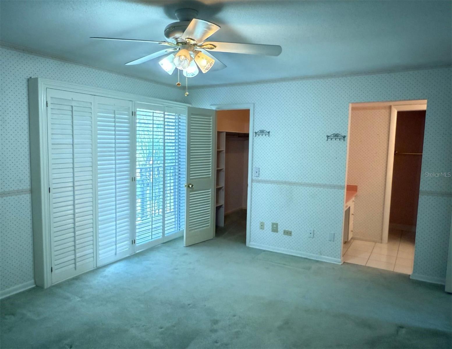 Primary w/custom shutters and Private Balcony