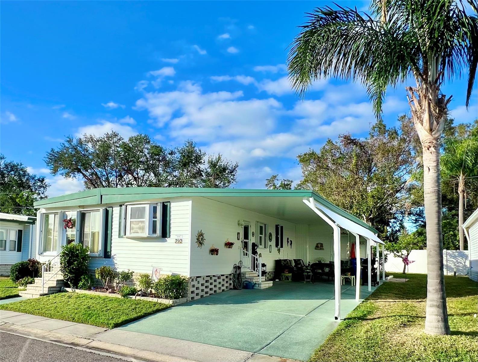 Front of home with extended carport