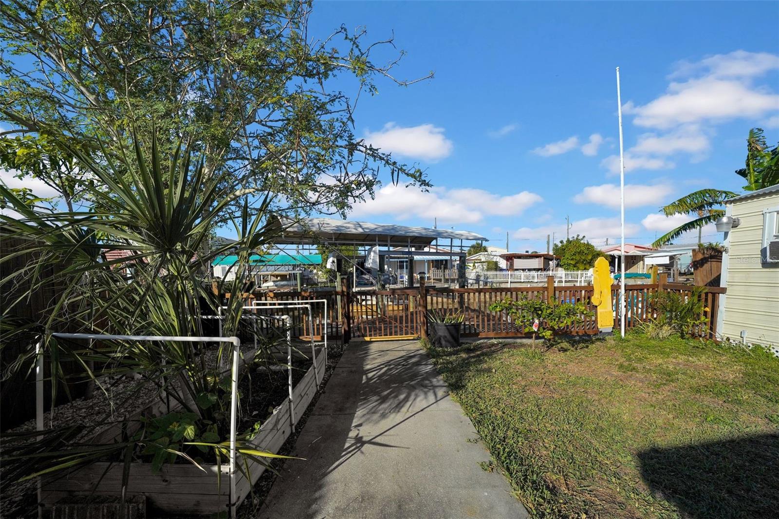 Fenced yard with Garden and fruit trees