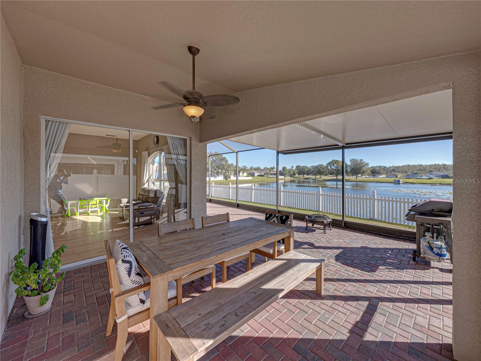 Screened lanai overlooks the pond and golf course