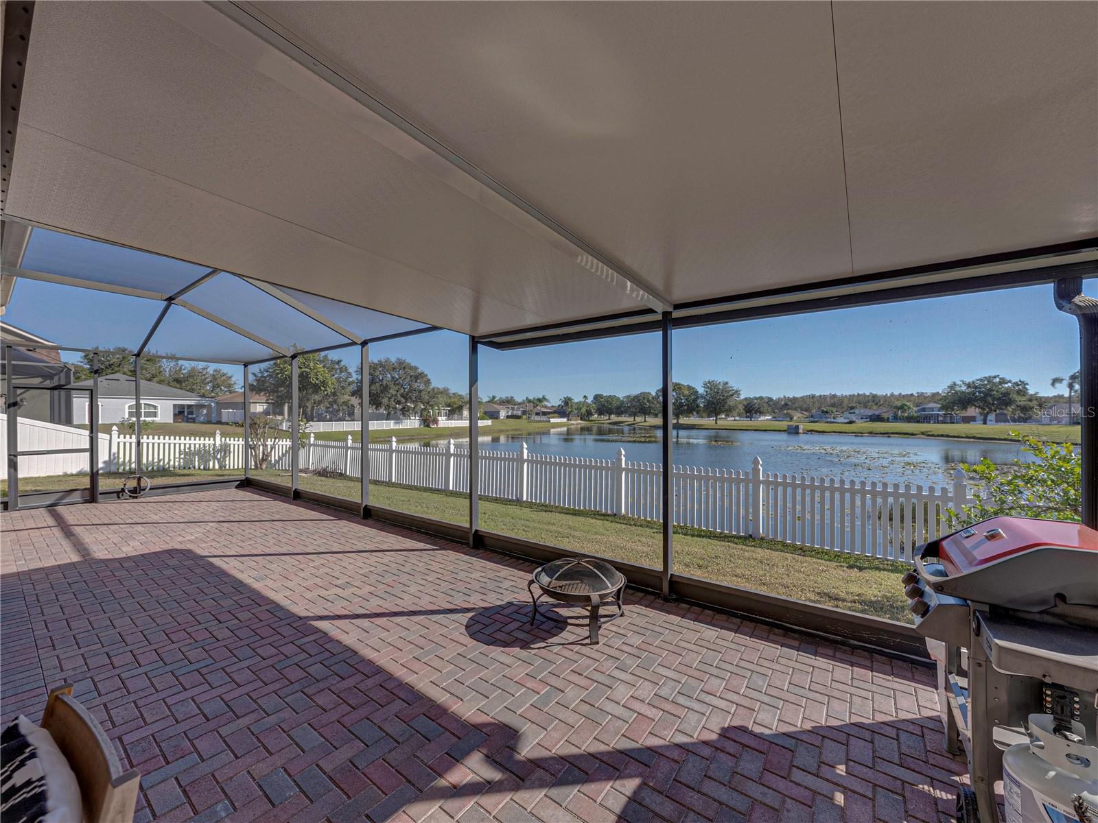 Screened lanai overlooks pond.