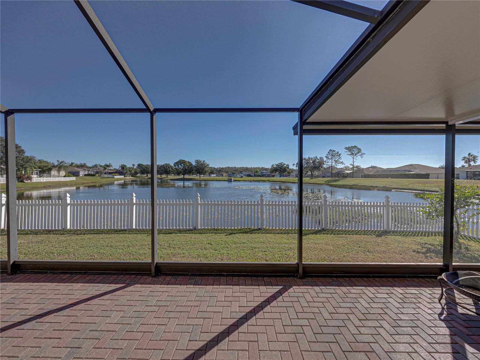 Screened lanai overlooks pond