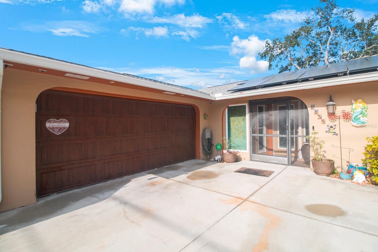 Front of home. Side 2 car garage.