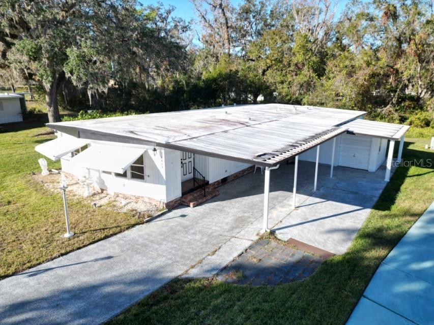 RV parking pad next to carport