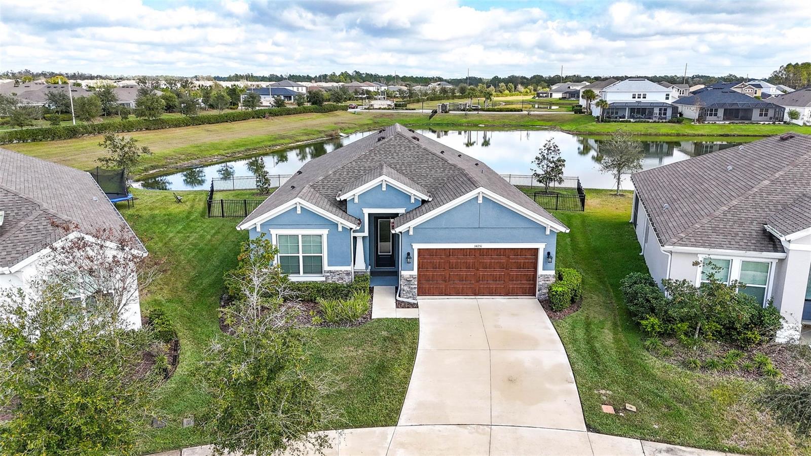 This property is located in the Radley village with a huge pie shaped fenced in yard & a pond view!