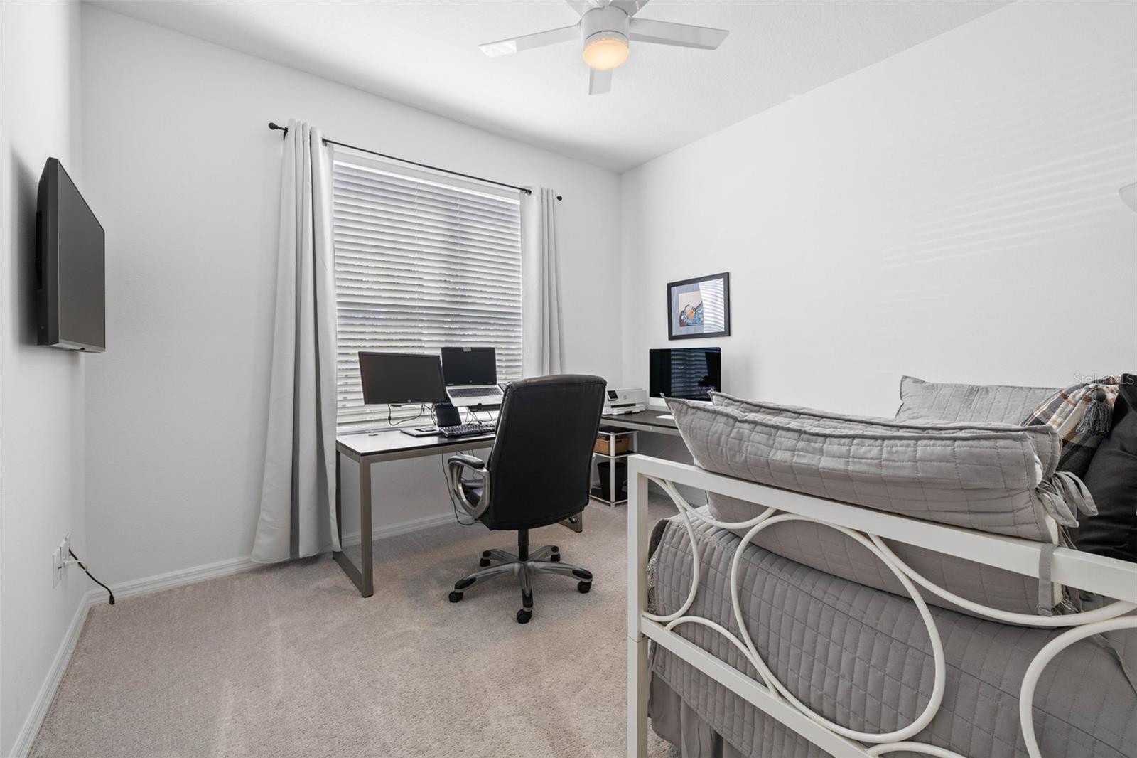 Bedroom 2 currently being used as an office with enough room for a daybed and trundle.