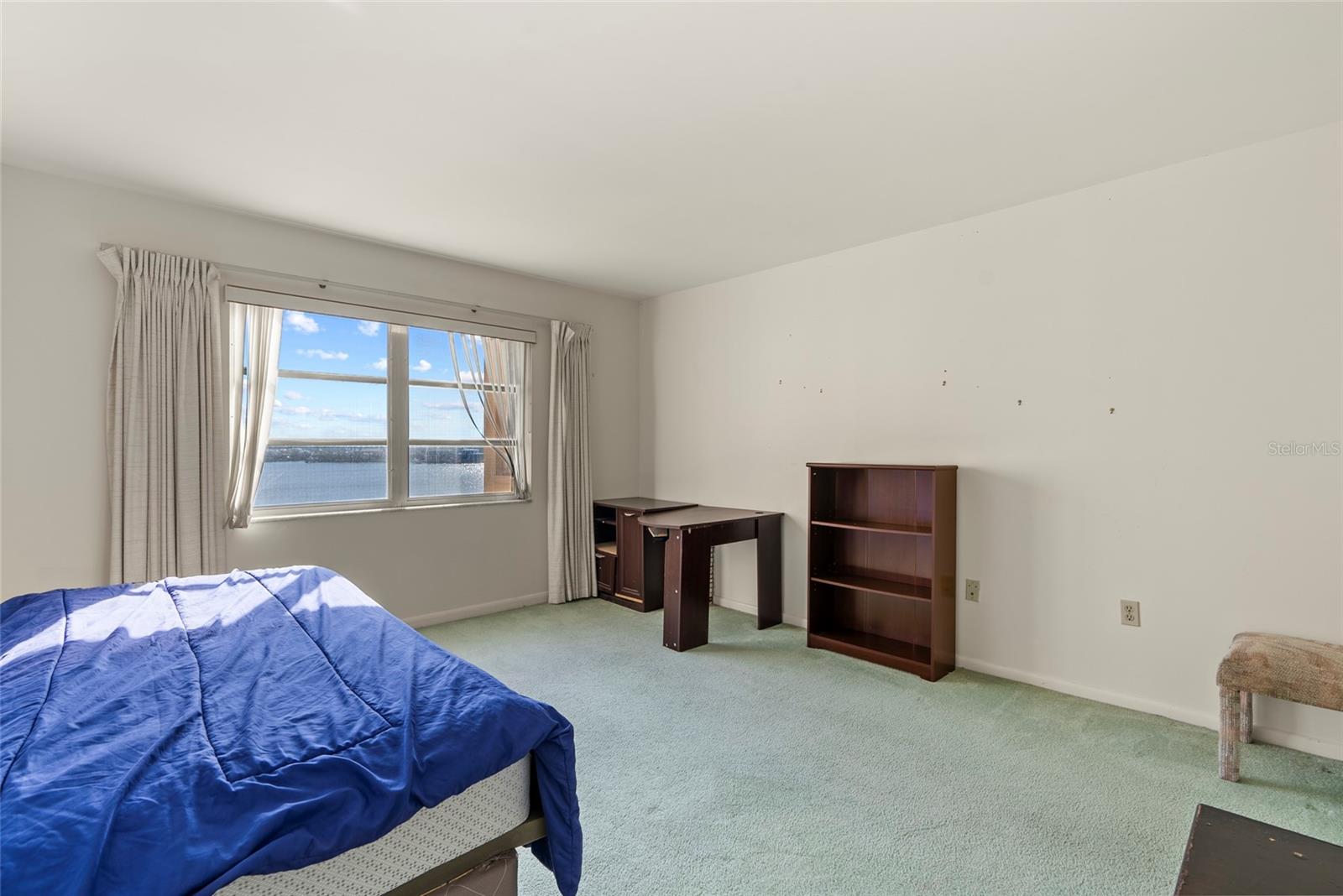 The guest bedroom features a spectacular water view as well as a walk-in closet.  The guest bathroom is right outside the guest bathroom