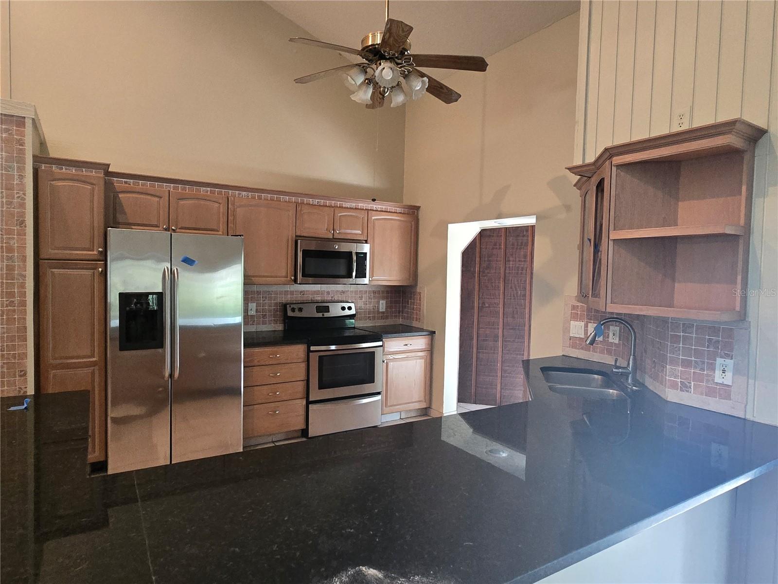 kitchen with massive counter, holds 8 barstools