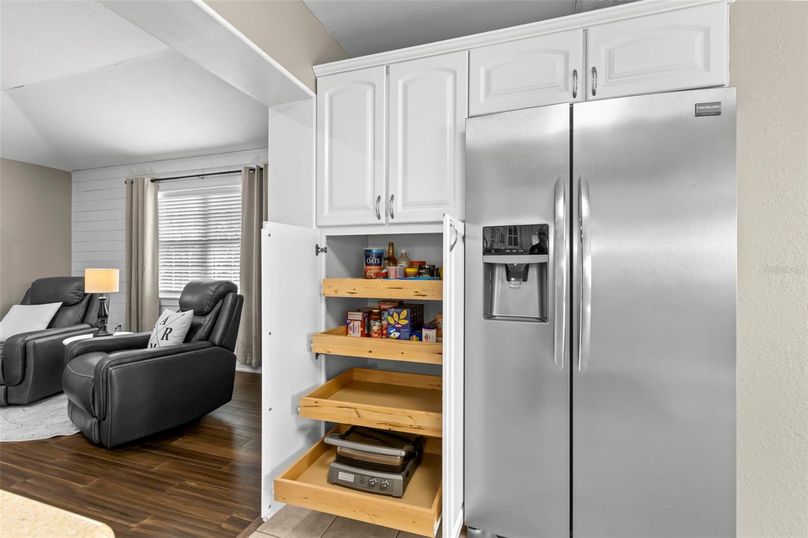 Kitchen Pantry showing pull out shelving.