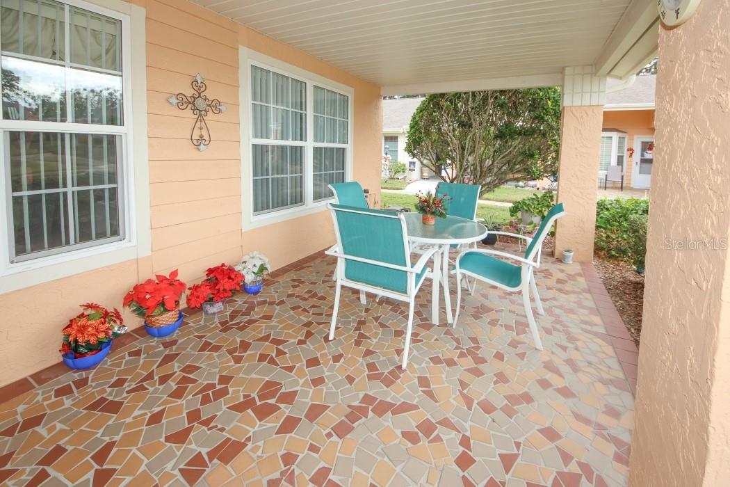 Enjoy a relaxing visit with friends or family on your  front porch