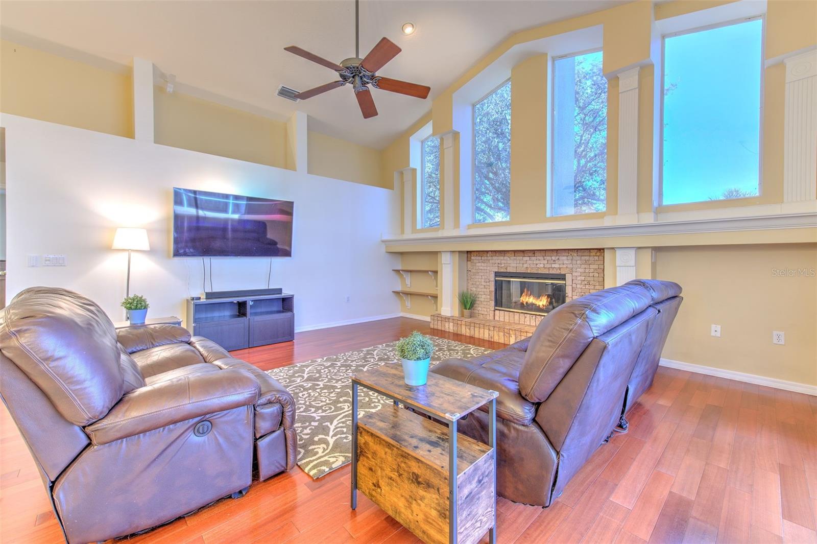 Family Room with fireplace and beautiful windows