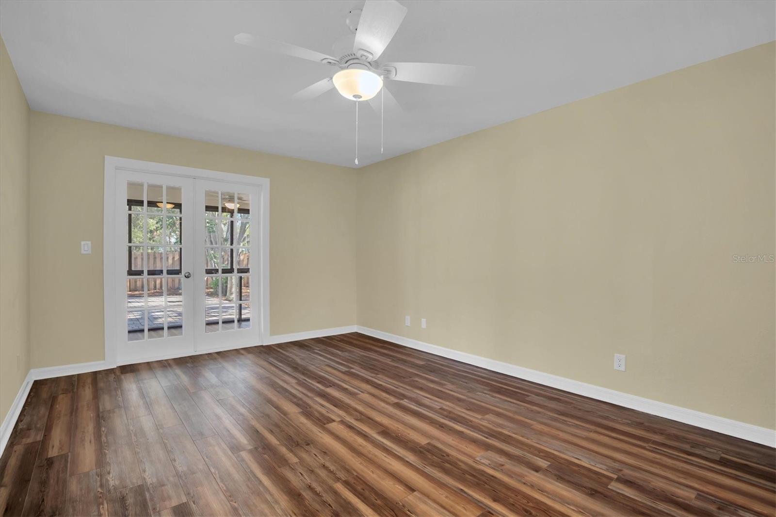 Master (Primary) Bedroom. French doors lead to Florida Room