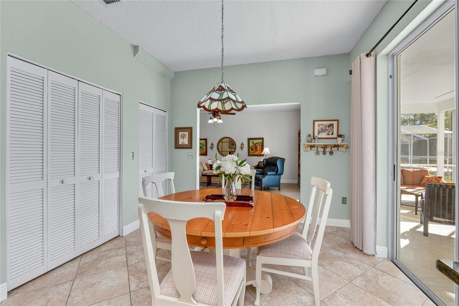 Large pantry, huge sliders, tile floor - this Kitchen is the heart of the home.