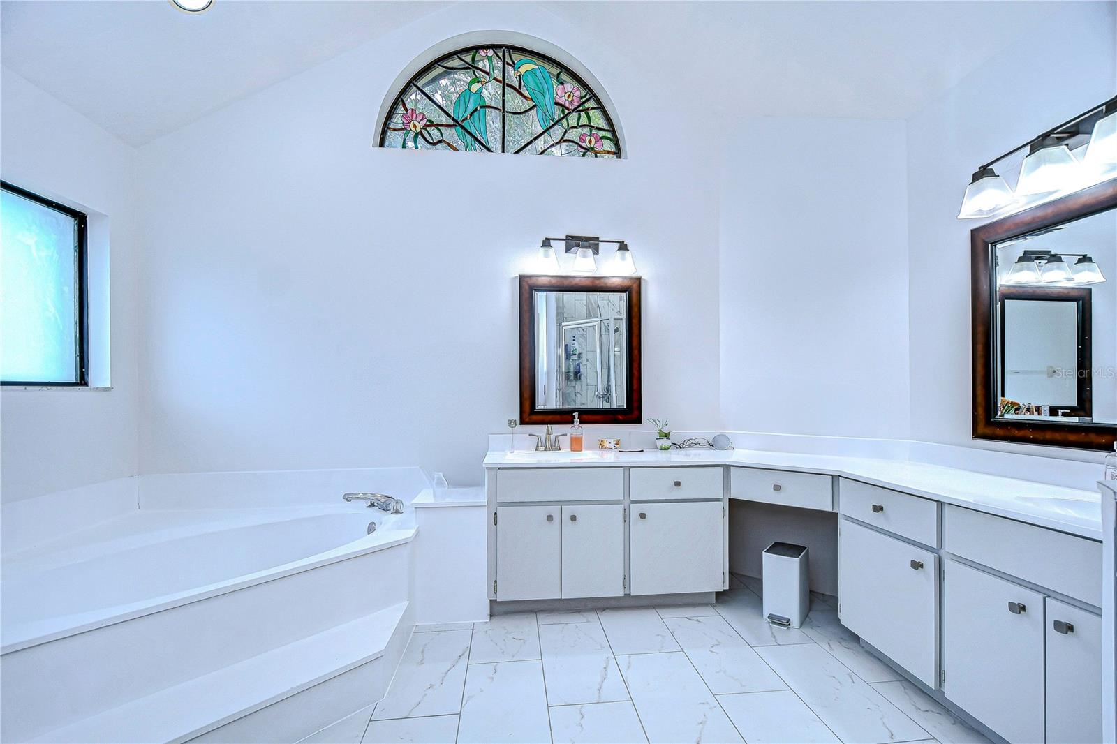 En-suite bath features a soaking tub and dual sinks!