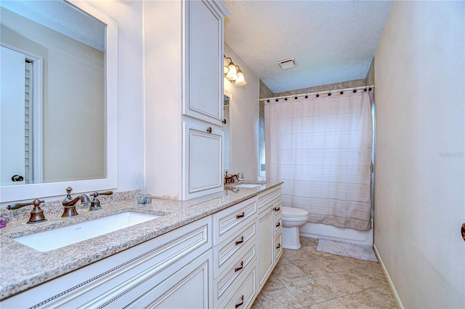 Third bathroom with granite counter tops and dual sinks!