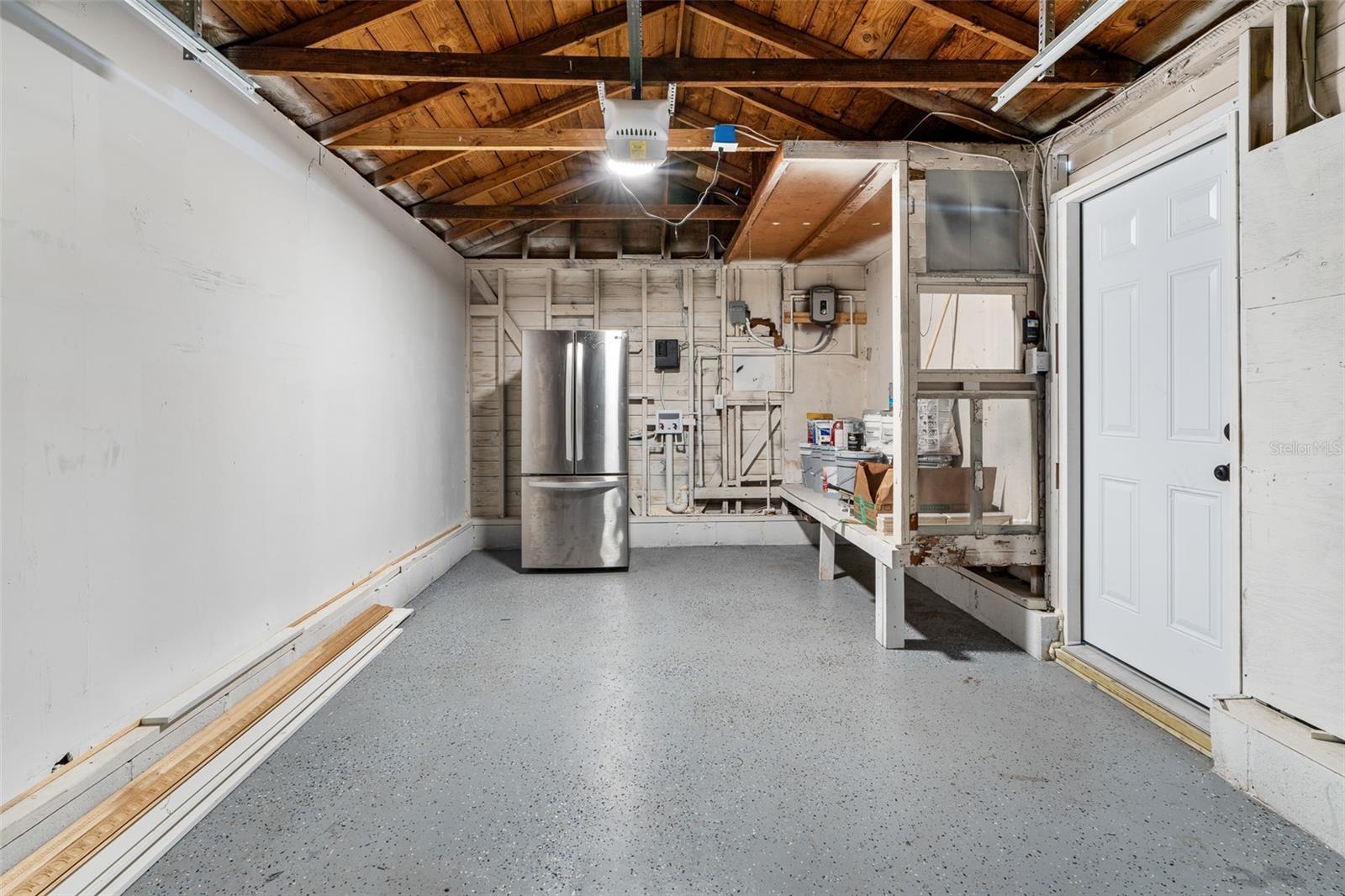 Refrigerator pictured in garage does not convey (but the one in kitchen photo does).