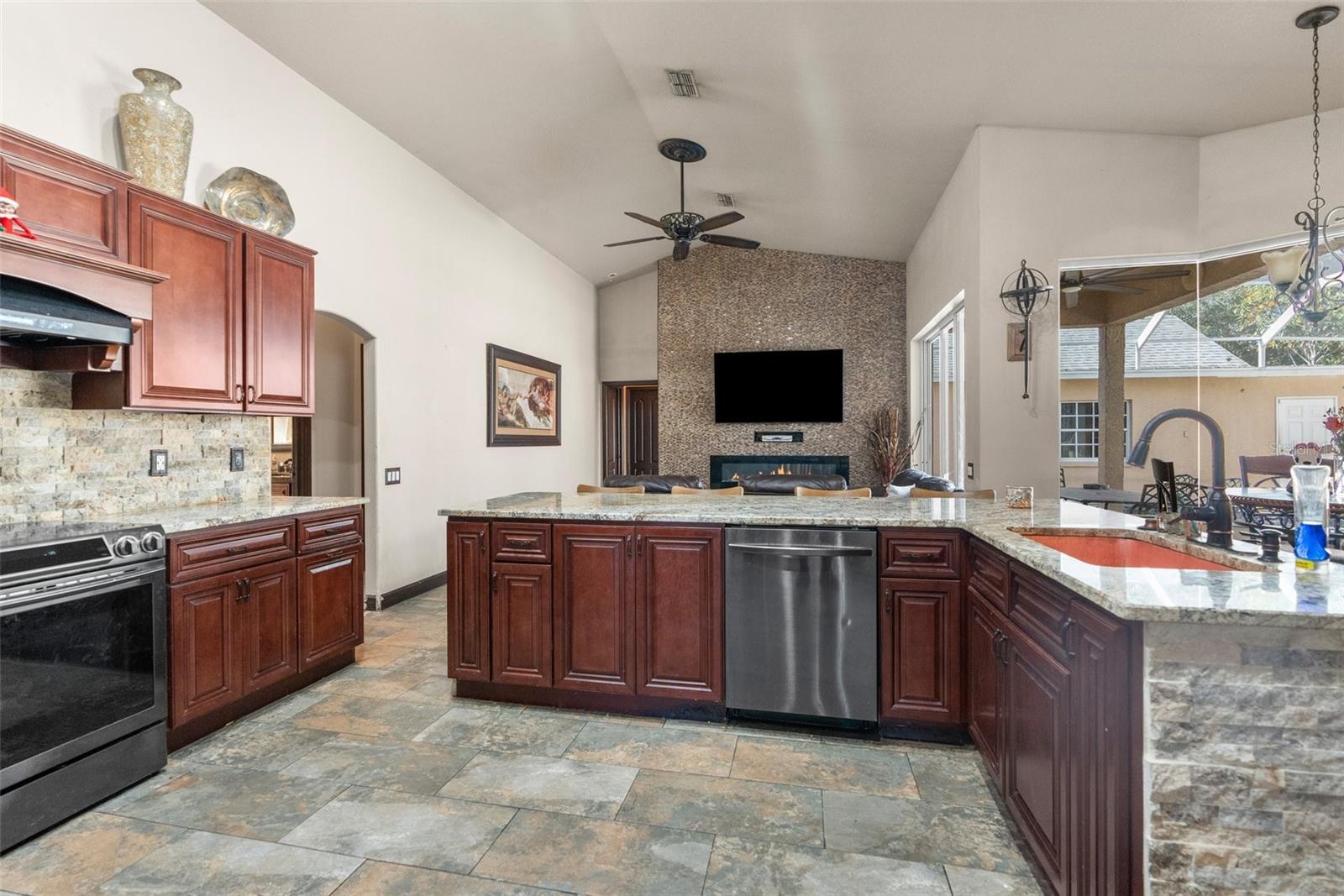 Large kitchen open to the family room and breakfast nook overlooking the pool,