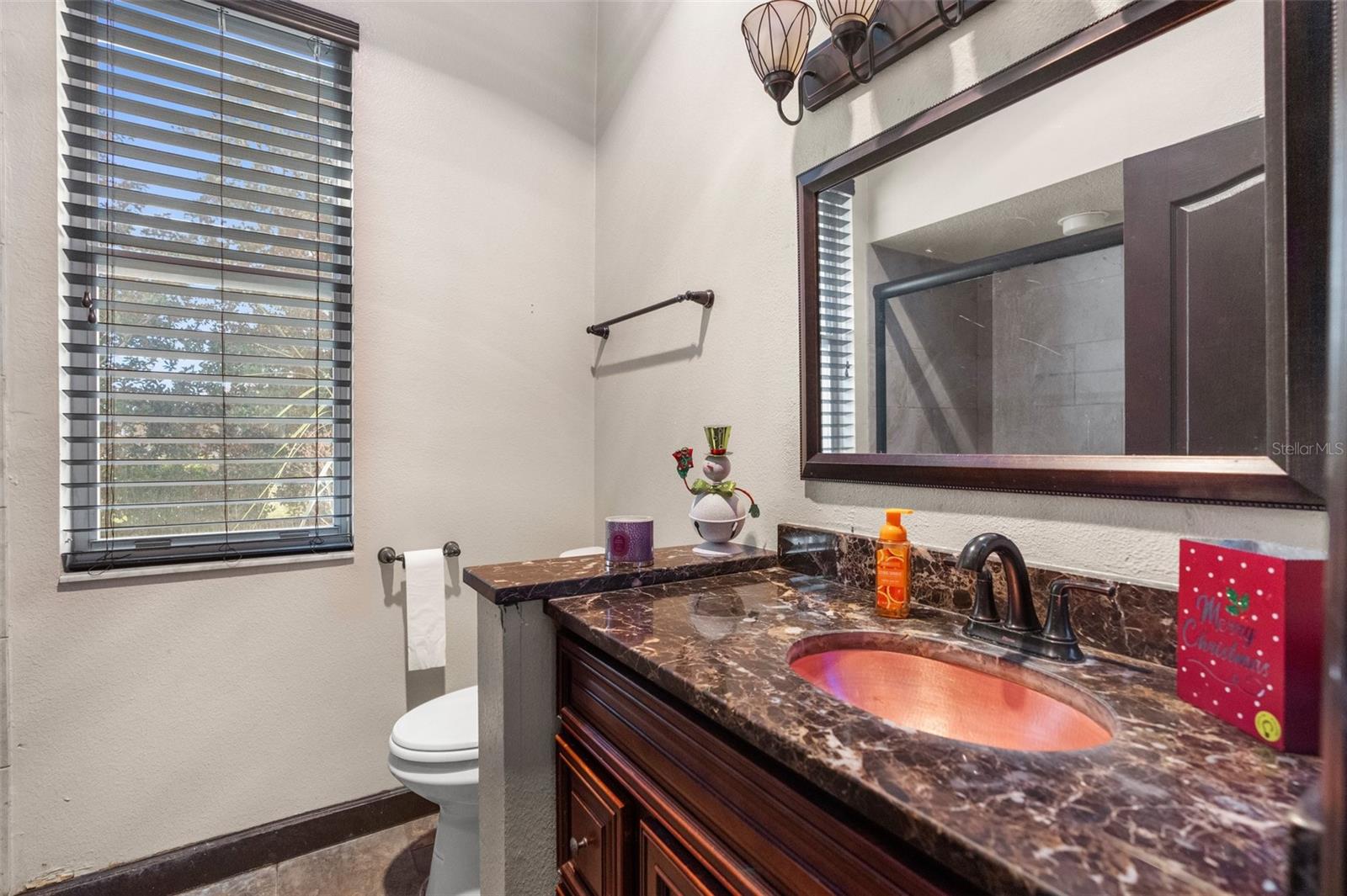 3rd bathroom has granite countertop, real wood vanity, shower only.