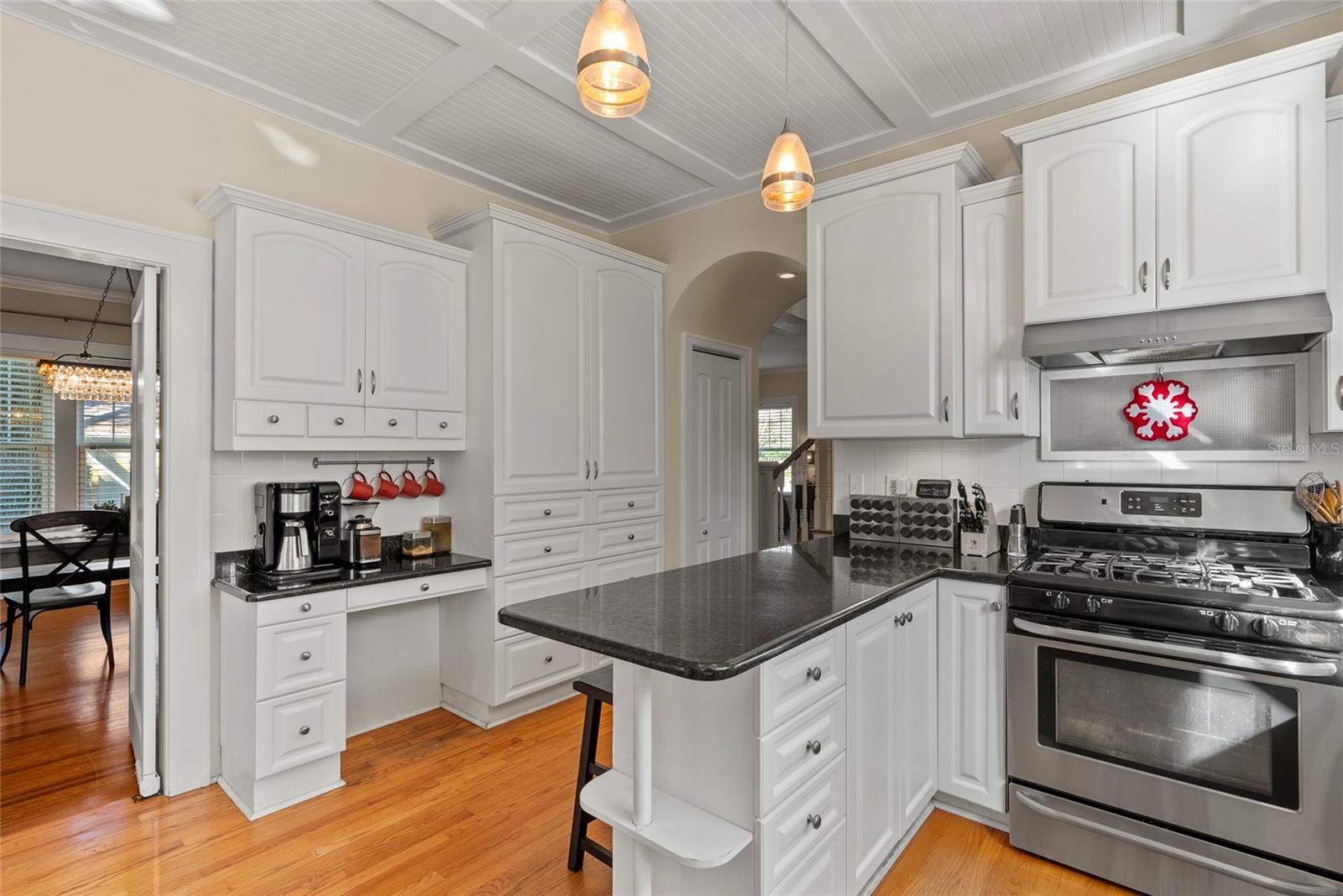 In addition to an ample amount of cabinet space and a pair of pantries, the kitchen has a built in dest.