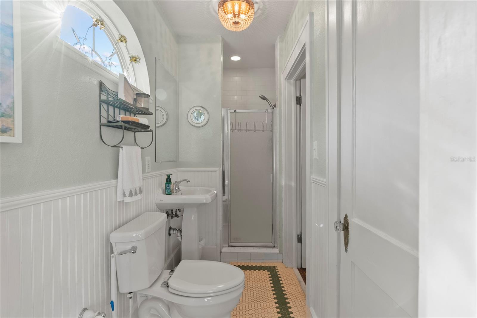 The first floor bathroom features a shower stall and generous sized linen-closet.