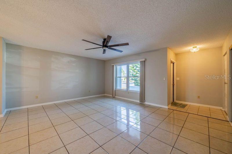 Living room with new fan and light fixture