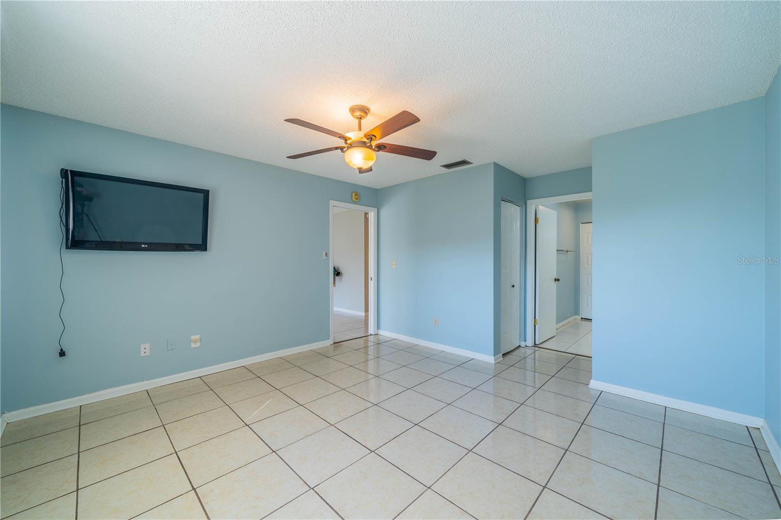 Master bedroom with mounted TV